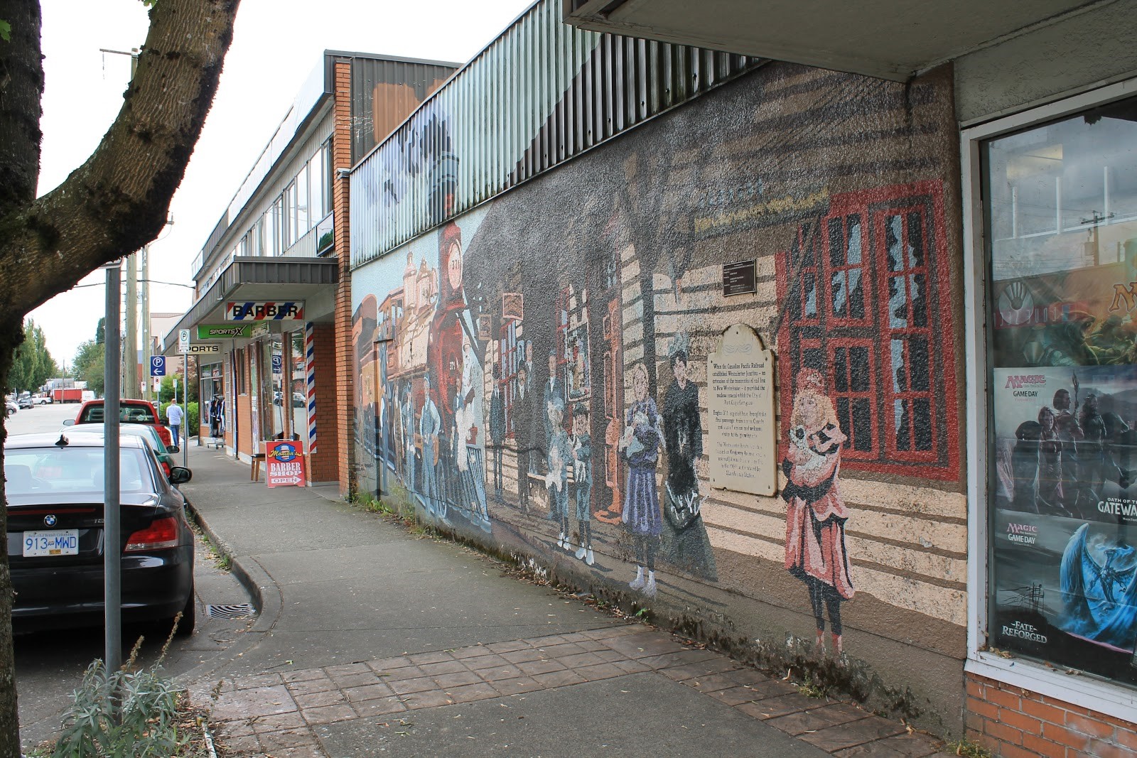 A photo of a wall mural with a train and the Westminster Junction train station.