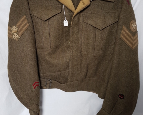 Olive green army jacket with rank insignia on both arms