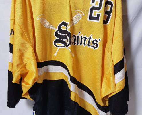 Yellow, black, and white lacrosse jersey, number 28 for the PoCo Saints