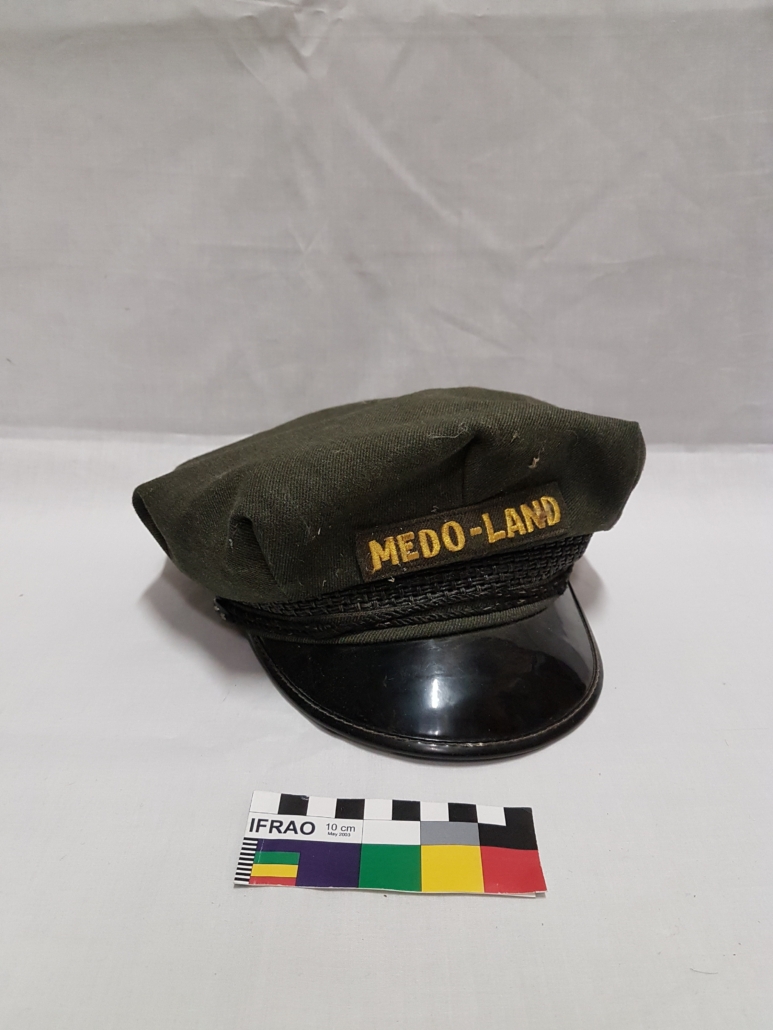 A green hat with black plastic bill and "Medo-Land" stitched in yellow
